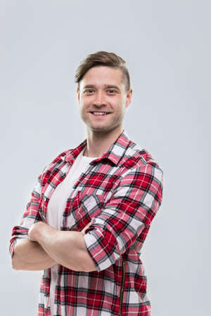 Casual Man Happy Smile Young Handsome Guy Folded Hands Wear Checked Shirt Isolated Over Grey Backgroundの写真素材