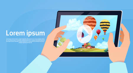 Hand Holding Modern Tablet Computer Watch Video Of Colorful Air Balloons Flying In Sky Flat Vector Illustrationのイラスト素材