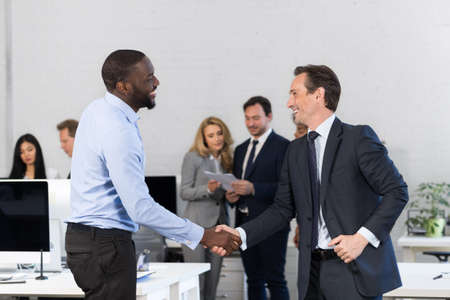 Handshake, Businessmen Shaking Hands During Meeting, Agreement In Front Of Business People...
