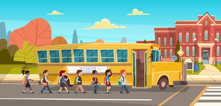 Group Of Pupils Mix Race Walking To School Building From Yellow Bus Primary Schoolchildren Students...