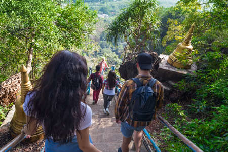 Young People Group Go Down Stairs Mountains Asian Holiday Summer Vacation Asian Travel Tourists Back Rear Viewの写真素材