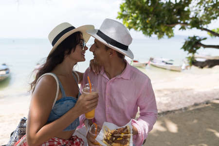 Beautiful Couple Embracing Over Sea Landscape Sitting In Park Man And Woman Tourists In Love Hugging...