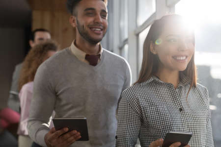 Mix Race Business Man Woman Group Using Cell Smart Phone Stand In Front Panoramic Window Happy Smiling Businesspeople Coworking Center Office Interiorの写真素材