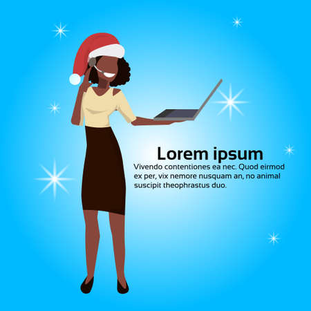 african american operator woman red hat hold laptop support service happy new year merry christmas concept flat blue background full length copy space vector illustrationのイラスト素材