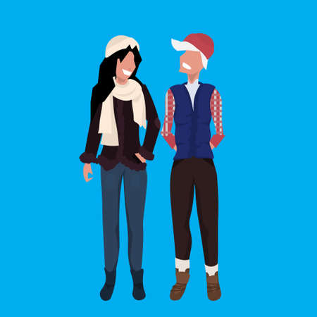 couple women wearing winter clothes female cartoon character full length blue background flat vector illustrationのイラスト素材