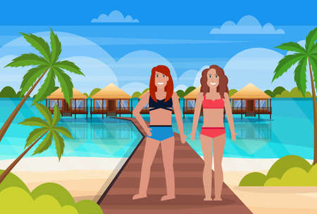couple women stand wooden path villa bungalow hotel on beach seaside green palms seascape tropical island summer vacation concept flat horizontal vector illustrationのイラスト素材