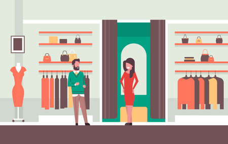 man seller consultant near woman trying on new dress elegant woman looking at mirror fashion shop female clothes market modern shopping mall interior flat horizontal vector illustrationのイラスト素材