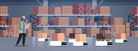 man engineer controlling robot car delivery product factory automation production concept modern...