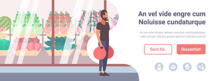 man holding shopping bags walking in front of fresh fruits vegetables modern supermarket shop glass window guy customer full length cartoon character flat copy space vector illustrationのイラスト素材