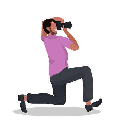 man photographer taking photo with camera african american guy standing on knee and shooting male...