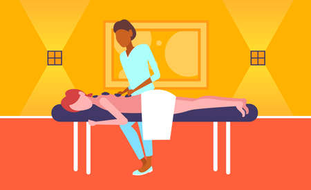 young girl enjoying traditional hot stone massage african american masseuse massaging patient woman hotel health spa concept horizontal full length vector illustrationのイラスト素材