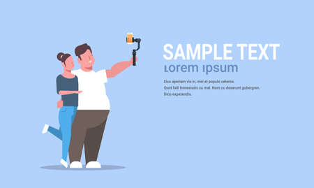 couple standing together overweight man with thin woman holding selfie stick taking photo on...