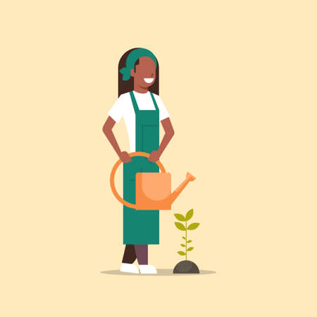 female farmer growing seedling plant flower or vegetable african american woman holding watering can gardener in uniform agricultural eco farming concept flat full length vector illustrationのイラスト素材