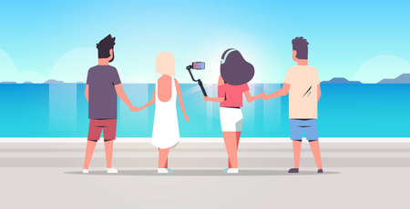 people group on beach using selfie stick taking photo on smartphone camera summer vacation concept...