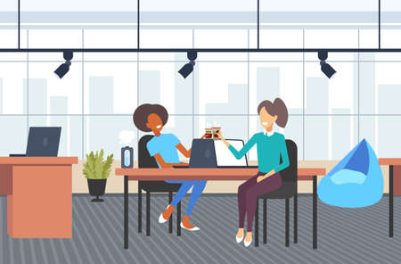 couple businesswomen colleagues discussing during coffee break mix race business women sitting at workplace communication concept modern office interior flat full length horizotal vector illustrationのイラスト素材