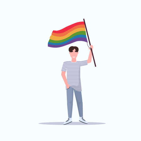 man gay holding lgbt rainbow flag love parade pride festival concept smiling male cartoon character full length flat vector illustrationのイラスト素材