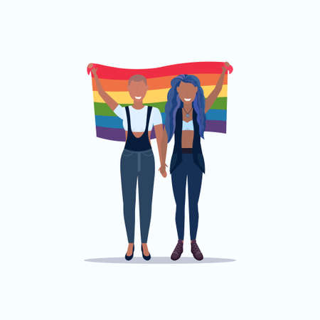 women couple holding rainbow flag love parade lgbt pride festival concept mix race lesbian female cartoon characters standing together full length flat vector illustrationのイラスト素材