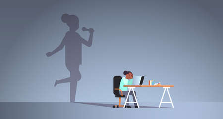 african american woman sitting at workplace using laptop shadow of singer holding microphone and...