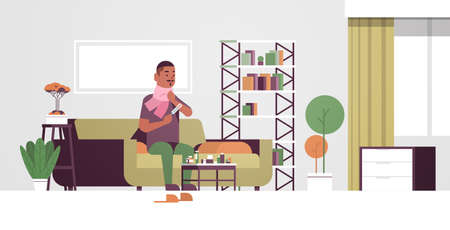 sick man measuring temperature with thermometer unhealthy african american guy in scarf suffering from cold flu virus illness concept modern living room interior flat full length horizontal vector illustrationのイラスト素材