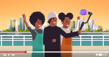 peope using selfie stick stabilizer african american travelers taking selfie photo on smartphone camera blogging shooting vlog concept modern cityscape background portrait horizontal vector illustrationのイラスト素材