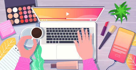 beauty blogger hands using laptop at workplace smartphone cosmetics coffee cup on desk social media network blogging concept top angle view horizontal vector illustrationのイラスト素材