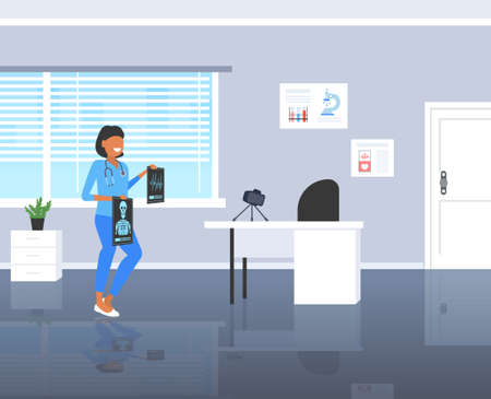 female doctor   examining x-ray picture surgeon recording video with camera on tripod medicine   concept modern clinic interior full length horizontal vector illustrationのイラスト素材