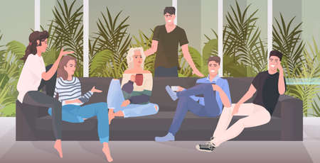 happy friends spending time together men women sitting on sofa having fun living room interior