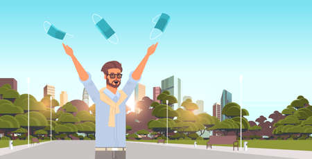 man throwing medical masks coronavirus win defeated covid-19 guy celebrating victory over nCoV virus ending pandemic quarantine concept cityscape background portrait horizontal vector illustrationのイラスト素材