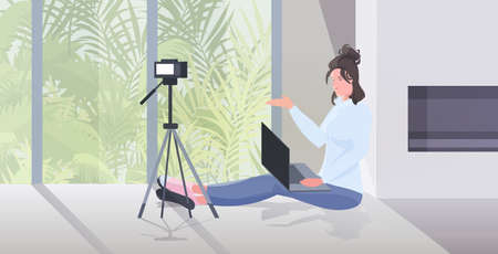 woman blogger recording video blog during coronavirus quarantine live streaming blogging conceptのイラスト素材