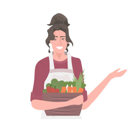 beautiful woman gardener holding basket with fresh vegetables healthy nutrition eco vegan food conceptのイラスト素材