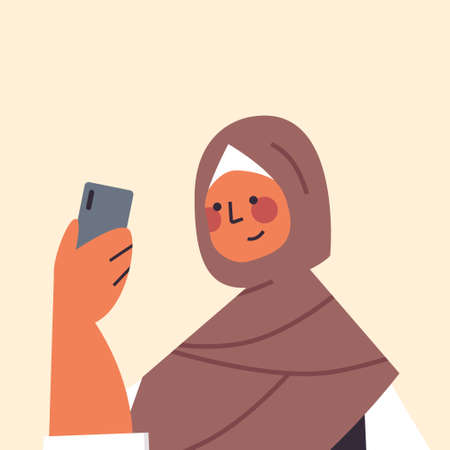 arabic woman in traditional clothes using smartphone smiling arab girl avatar female cartoon characterのイラスト素材