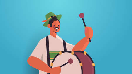 musician playing drum on biggest folk festival Oktoberfest party celebration concept