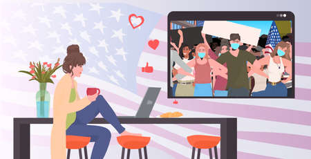 woman using laptop watching online video people in masks holding usa flags labor day celebration...