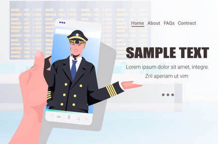 male pilot in uniform on smartphone screen self isolation aviation concept horizontal