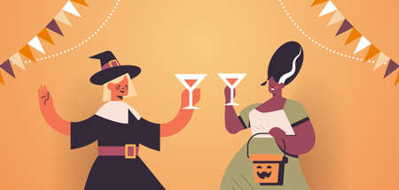 women in costumes celebrating happy halloween holiday mix race girls drinking cocktails having bar partyのイラスト素材