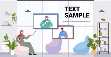 arab woman patient discussing with doctors during video call online medical consultation virus...