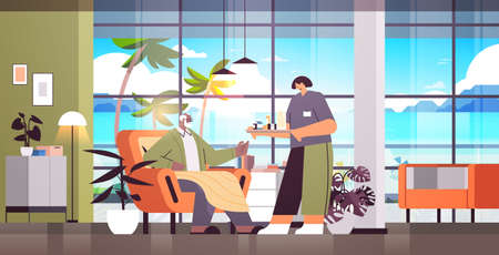 friendly nurse or volunteer bringing pills to elderly man patient home care services healthcare and social supportのイラスト素材