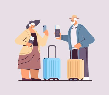 elderly couple of tourists grandparents with luggage passports and tickets ready to boarding at airport vacationのイラスト素材