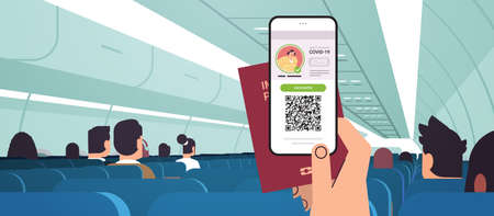passenger hand holding digital vaccinate certificate and global immunity passport in airplane coronavirus immunityのイラスト素材