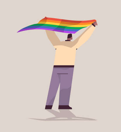 man holding lgbt rainbow flag gay lesbian love parade pride festival transgender love concept full lengthのイラスト素材