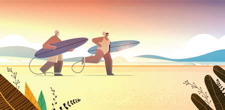 senior couple with surf boards aged man woman surfers holding surfboards summer vacation active old...