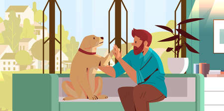 young man spending time with dog male owner and cute domestic animal friendship with pet conceptのイラスト素材