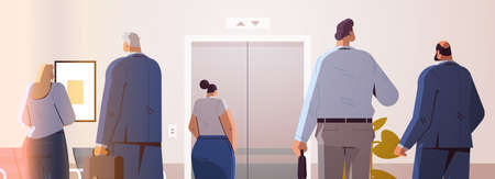 businesspeople standing back to camera rear view of business people group in office corridor