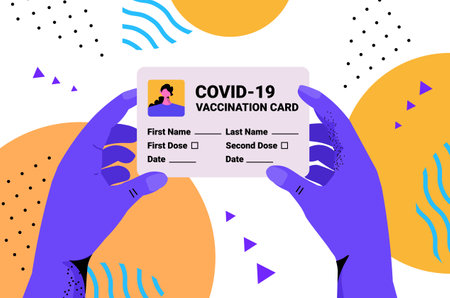 hands holding covid-19 vaccination record card global immunity passport risk free re-infection pcr...