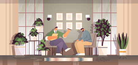 depressed man visiting psychologist male psychotherapist consulting patient during psychotherapy session mental health depressionのイラスト素材