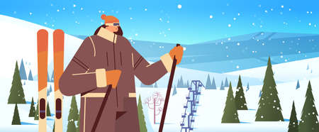 skier woman standing with equipment sportswoman skiing doing activities winter vacation concept snowfall landscapeのイラスト素材