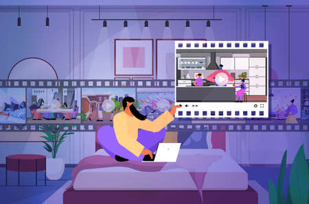 woman blogger sharing or watching videos at social networks making posts for followers social media addictionの写真素材