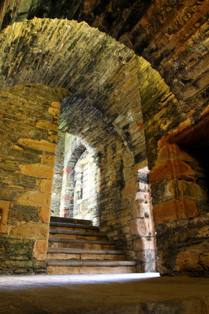 Stone arch and steps in castleの写真素材