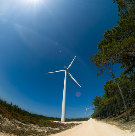 Modern white wind turbine or wind mill producing clean energy 
