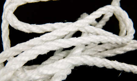 white nylon rope in black backgroundの写真素材